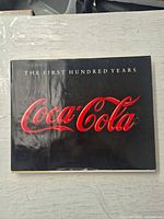 Front cover showing title and Coca-Cola logo