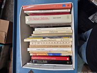 Top view of box showing spines of approximately 18 art and photography books