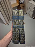Spine view showing titles and publisher mark