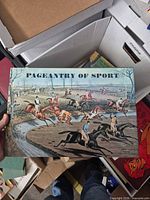 Front cover showing title Pageantry of Sport and equestrian hunting illustration