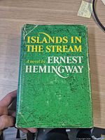 Front of dust-jacketed book showing title, author, color and wear