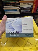 Front of boxed Joshua Maxwell Studio Haiku Noodle Set showing brand and contents list