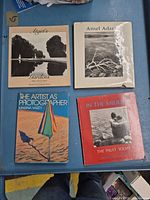 All four books laid out on table