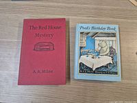 Front covers of both hardcover books side by side