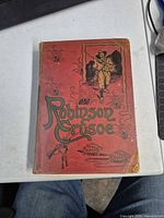 Front cover showing red illustrated cloth binding