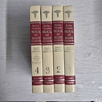 Spine view of all four volumes showing titles, editor, volume numbers and publisher