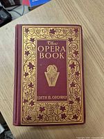 Front cover showing ornate gilt design and title