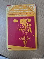 Front view of book showing full dust jacket design and wear