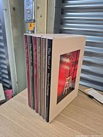 Front view of six hardcover volumes in slipcase