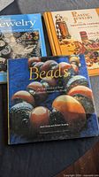 Three jewelry reference books laid out together