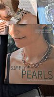 Covers of both books, Simply Pearls in foreground, Jewelry Design partially visible behind
