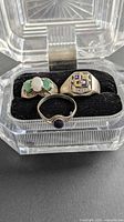 Three sterling silver rings in clear case