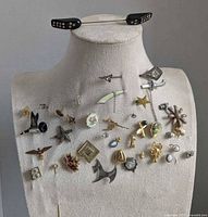 Full display of all pins on mannequin form