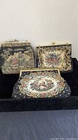 All three vintage tapestry handbags displayed together