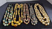 Overall view of all necklaces and earrings on display board