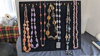 Full display board showing all nine stone necklaces