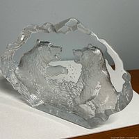 Front angled view showing full sculpture and etched bear detail