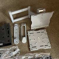 Assorted black and silver mount arms, plates and brackets