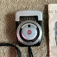 Front view of GE PR-1 meter showing dial and logo