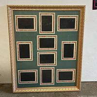 Front view of gold wood collage frame with green mat and 11 openings