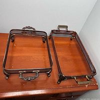 Both Leonard silverplate tray stands viewed from above showing size difference and handles