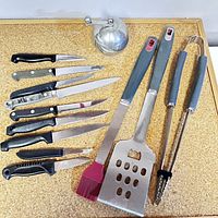 Group shot of knives, utensils and Peugeot mill