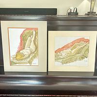 Both matted watercolor paintings on display