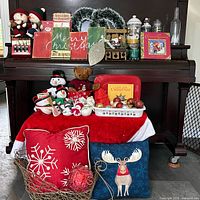 Overall view of all Christmas items arranged on piano and bench