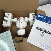 Light fixture, manual and warranty certificate inside original packaging