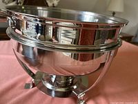 Overall view of the chafing dish showing pan seated in stand