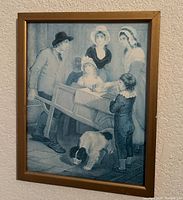 Print showing family with wheelbarrow and dog in gold frame