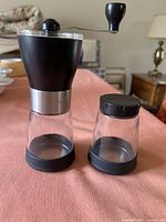 Grinder and storage jar front view showing components