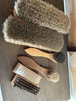 All six brushes arranged on table showing sizes and bristle types