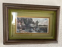 Horizontal pastoral print in wood frame with green mat