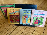 Front view of three books and slipcase