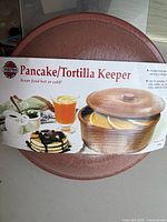 Front view of Norpro pancake/tortilla keeper with packaging