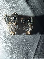 Front view of both owl earrings