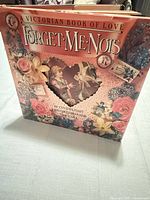 Front cover showing title, authors, floral Victorian design