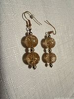 Front view of earrings showing beads and hooks