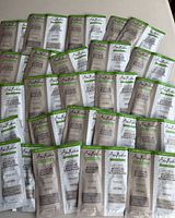 All 50 SheaMoisture sachets spread out
