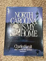 Front cover showing title, authors, lighthouse, dust jacket