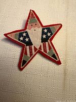 Front view showing Santa Claus American flag design on felt star