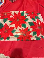 Rectangular tray with poinsettia design displayed on red tablecloth
