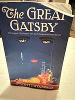 Front cover showing title, author, artwork, and damaged corner