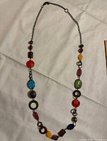 Full view of necklace laid flat showing overall design and bead arrangement