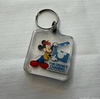 Front view of lucite keychain showing Mickey Mouse graphic and Disney Channel logo