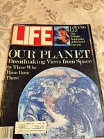 Front cover displaying title, feature stories and Earth image