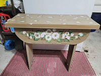 Full view of hand painted wooden bench