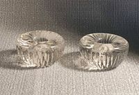 pair of clear glass candle holders front view