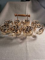 Front view of eight Laurel pattern glasses in caddy